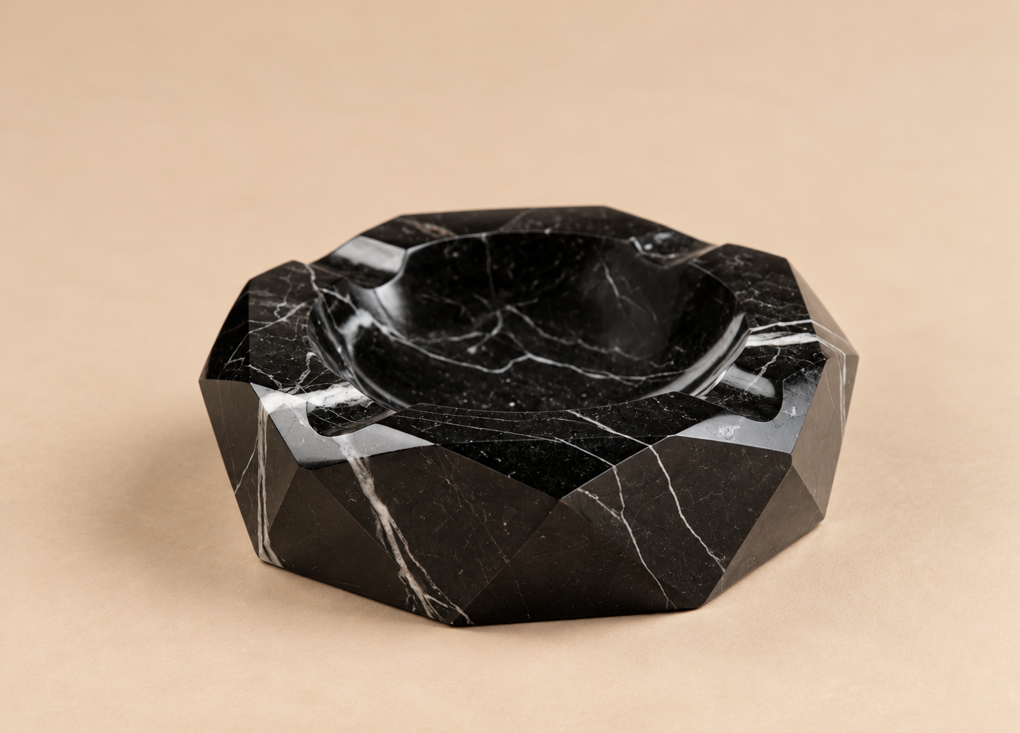 FacetedBlackMarbleAshtrayonBeige.png